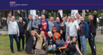 PSP Cargo Group team smiling and waving in a group photo during the team building in Voineasa